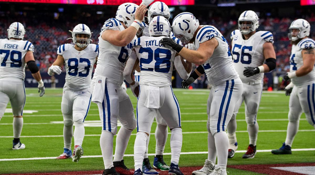 The Indianapolis Colts celebrate a touchdown by running back Jonathan Taylor (28) during the first quarter of the game Sunday, Dec. 5, 2021, at NRG Stadium in Houston. Indianapolis Colts Versus Houston Texans On Sunday Dec 5 2021 At Nrg Stadium In Houston Texas