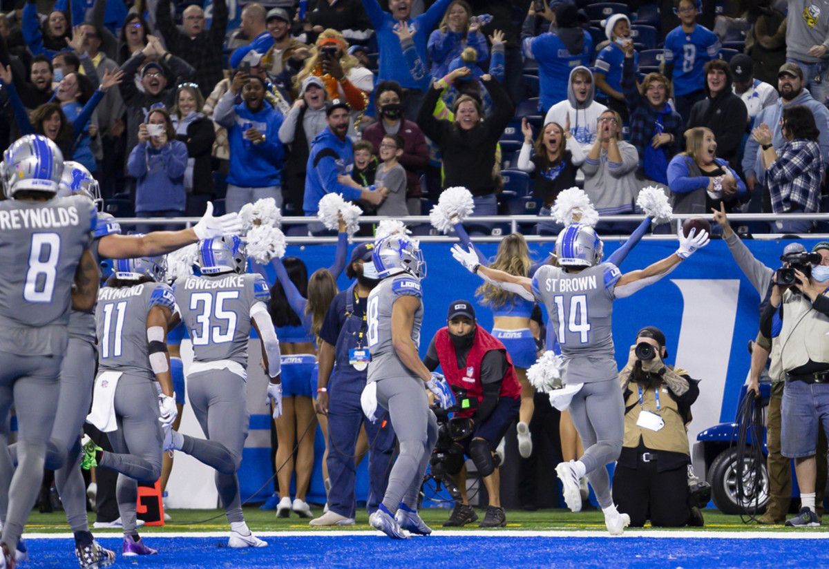 Detroit Lions wideout Amon-Ra St. Brown celebrates a touchdown at Ford Field.