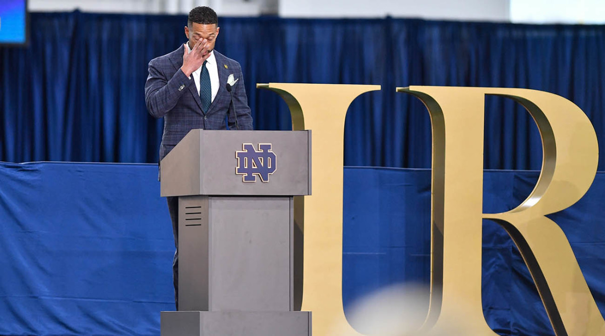 Notre Dame Fighting Irish head football coach Marcus Freeman becomes emotional during his formal introduction.