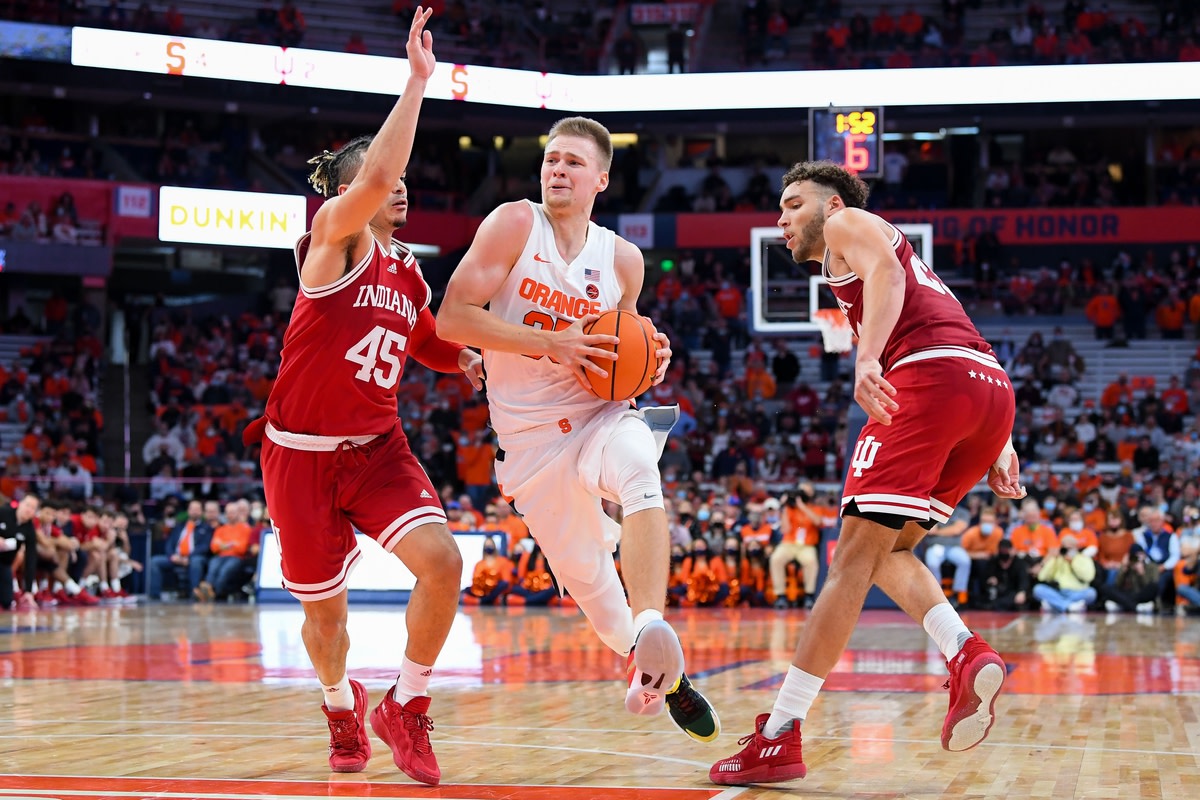 Nov 30, 2021; Syracuse, New York, USA; Syracuse Orange guard Buddy Boeheim (35) drives to the basket between Indiana Hoosiers guard Parker Stewart (45) and forward Race Thompson (right) defends during the second half at the Carrier Dome. Mandatory Credit: Rich Barnes-USA TODAY Sports