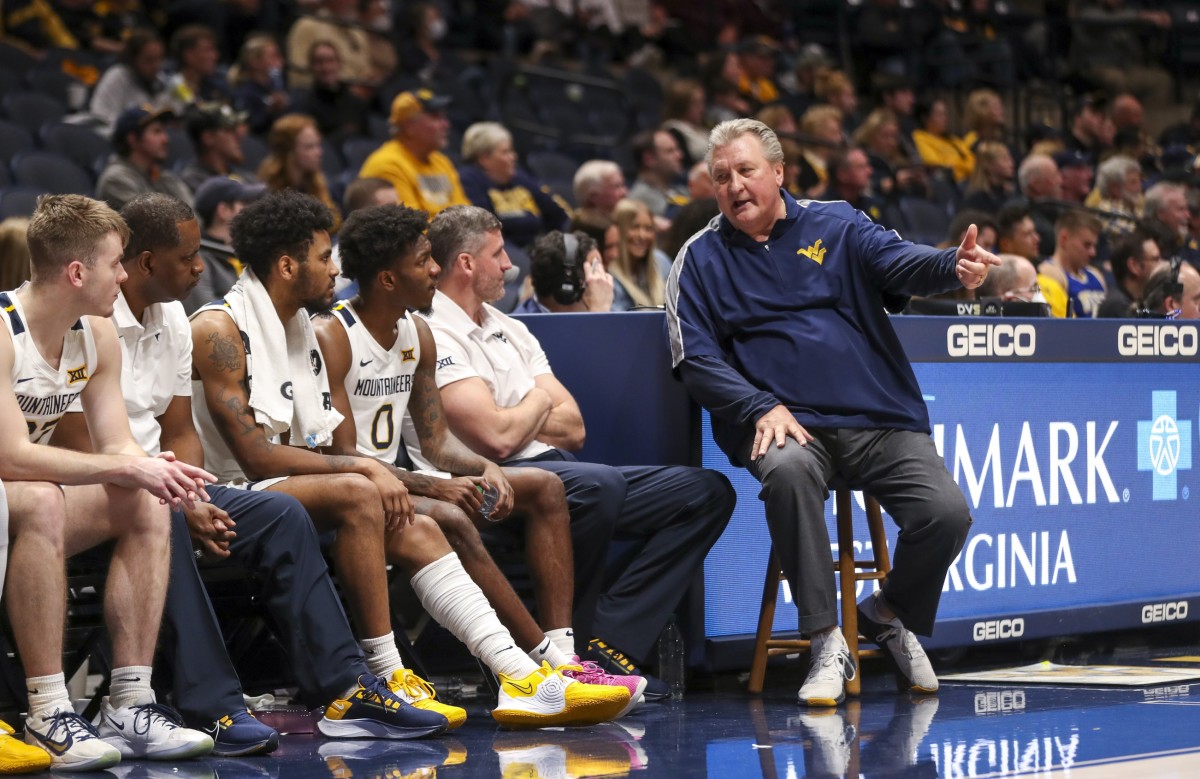 Nov 30, 2021; Morgantown, West Virginia, USA; West Virginia Mountaineers head coach Bob Huggins talks to players on the bench during the second half against the Bellarmine Knights at WVU Coliseum.