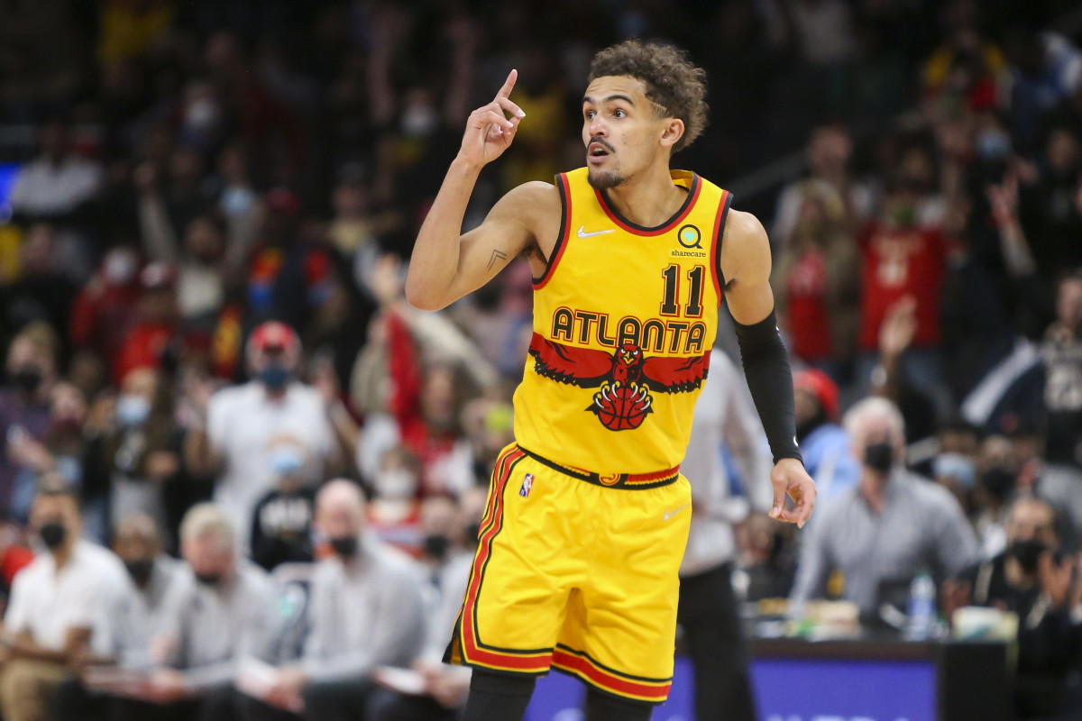Atlanta Hawks guard Trae Young (11) celebrates after a basket against the Charlotte Hornets in the second half at State Farm Arena.