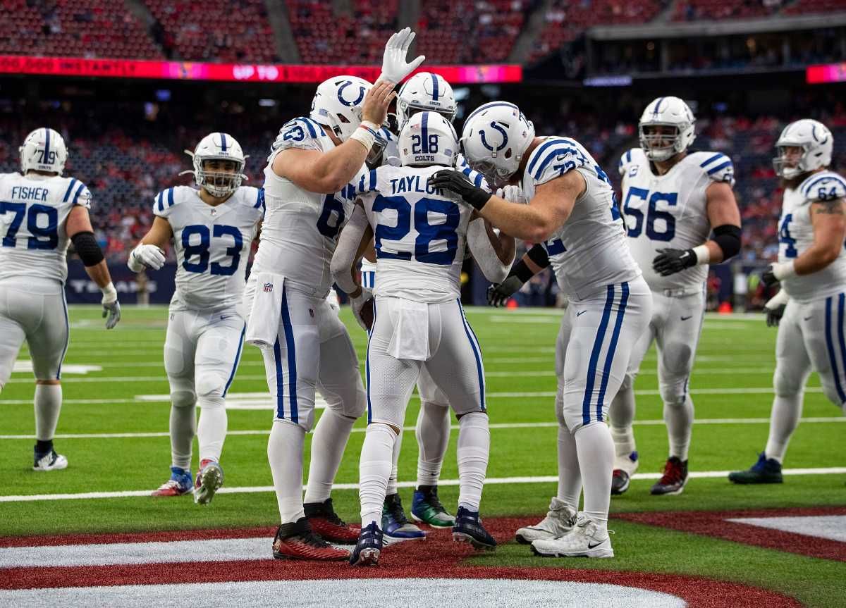 The Indianapolis Colts celebrate a touchdown by running back Jonathan Taylor (28) during the first quarter of the game Sunday, Dec. 5, 2021, at NRG Stadium in Houston. Indianapolis Colts Versus Houston Texans On Sunday Dec 5 2021 At Nrg Stadium In Houston Texas