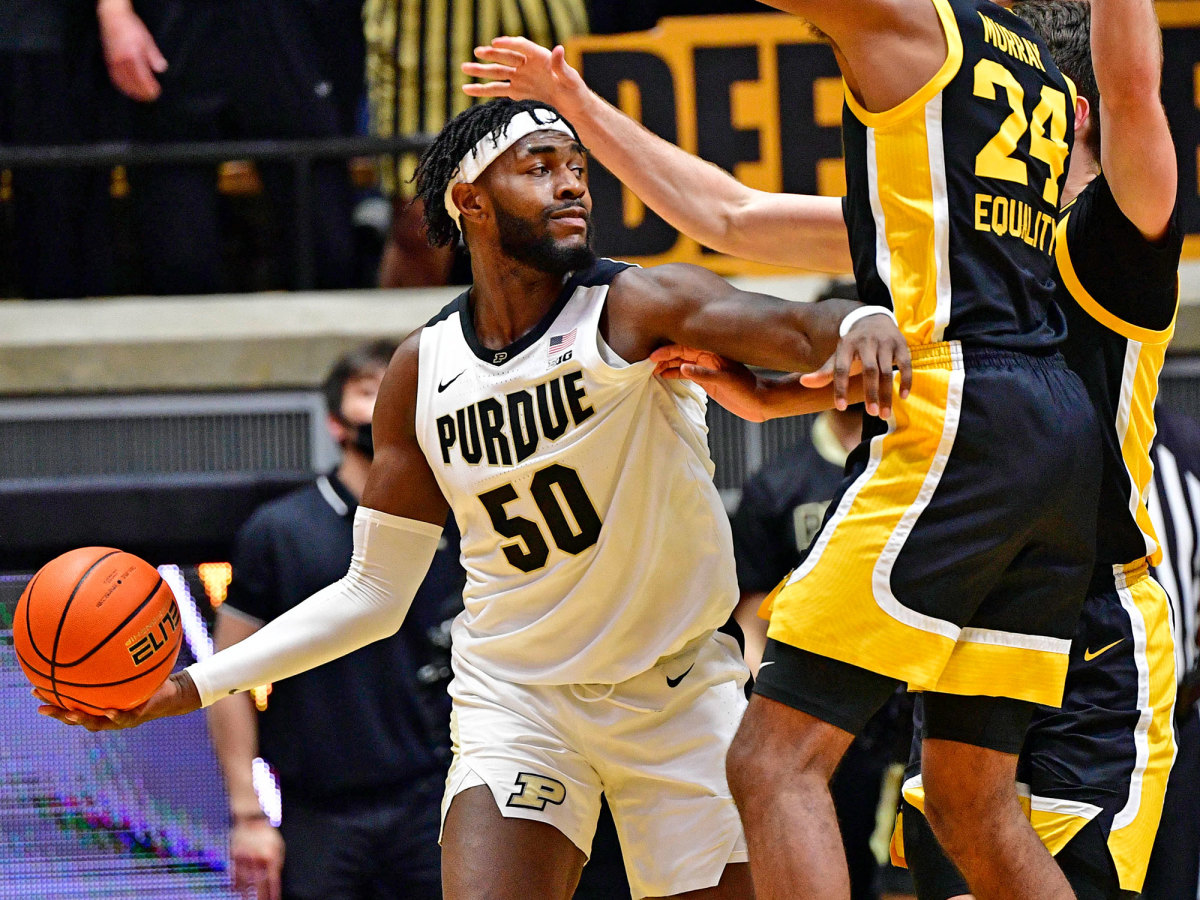 Purdue center Trevion Williams looks to pass