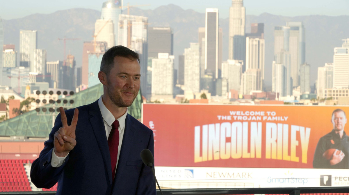 Nov 29, 2021; Los Angeles, CA, USA; Lincoln Riley poses with Fight on sign during a press conference to introduce Riley as Southern California Trojans head coach.