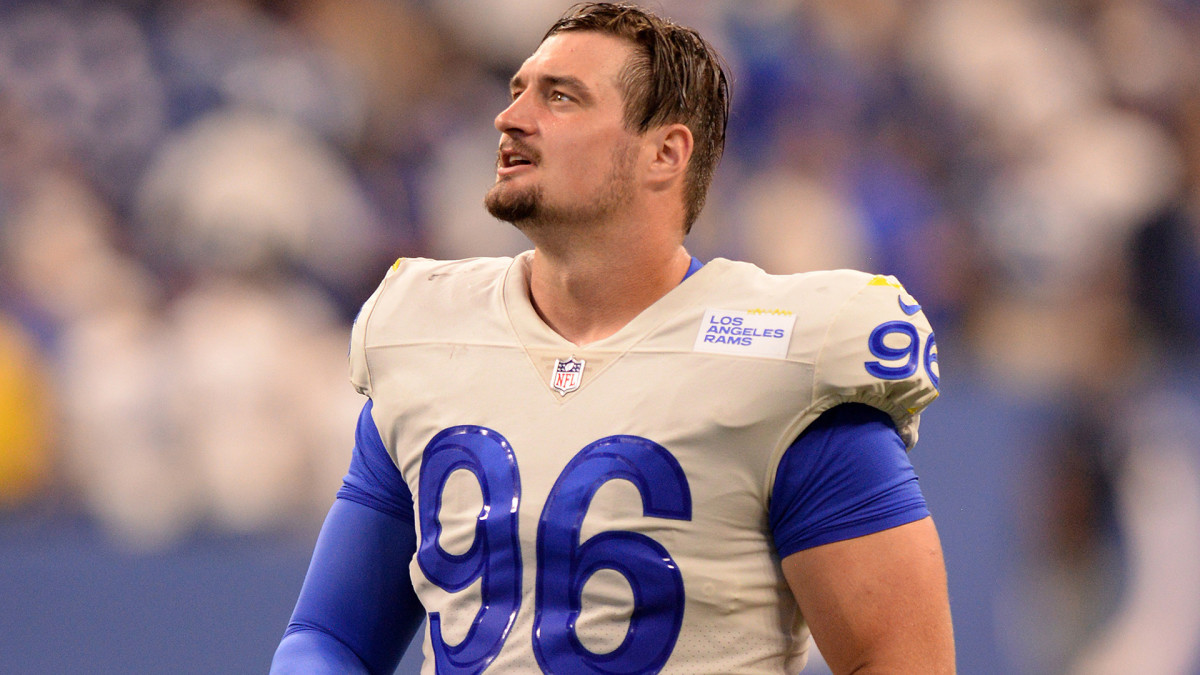 Michael Hoecht walks on the field before a game between the Rams and the Giants.