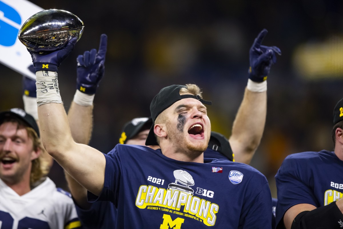 Dec 4, 2021; Indianapolis, IN, USA; Michigan Wolverines defensive end Aidan Hutchinson (97) celebrates after defeating the Iowa Hawkeyes in the Big Ten Conference championship game at Lucas Oil Stadium.
