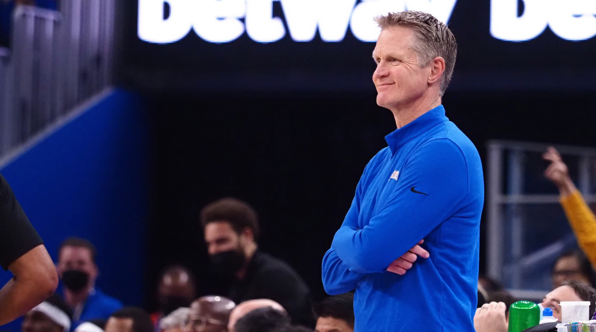 Dec 6, 2021; San Francisco, California, USA; Golden State Warriors head coach Steve Kerr smiles between plays against the Orlando Magic during the first quarter at Chase Center.