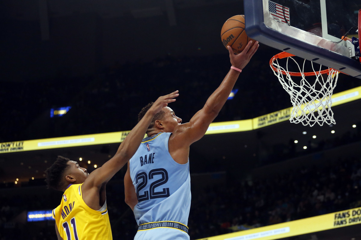 Memphis Grizzles guard Desmond Bane (22) drives to the basket as Los Angeles Lakers guard Malik Monk (11) defends during the second half at FedExForum.