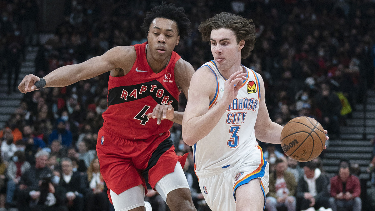 Oklahoma City Thunder guard Josh Giddey dribbles the ball as Toronto Raptors forward Scottie Barnes defends during the second quarter at Scotiabank Arena.