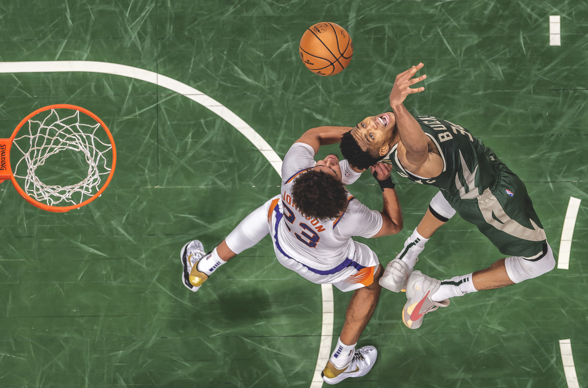 Milwaukee's Giannis Antetokounmpo goes for a rebound during  the 2021 NBA Finals.