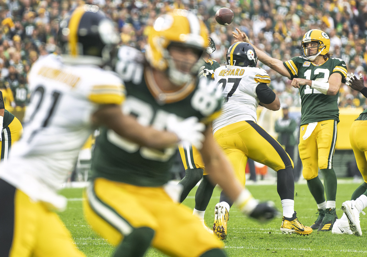 Packers quarterback Aaron Rodgers throws downfield during an October game against the Steelers at Lambeau Field.