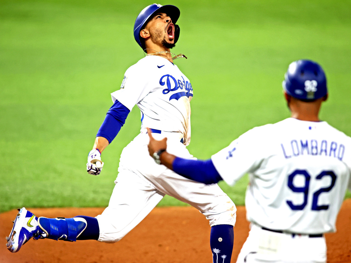 Oct 27, 2020; Arlington, Texas, USA;  Los Angeles Dodgers right fielder Mookie Betts (50) celebrates after hitting a home run during the eighth inning against the Tampa Bay Rays during game six of the 2020 World Series at Globe Life Field.