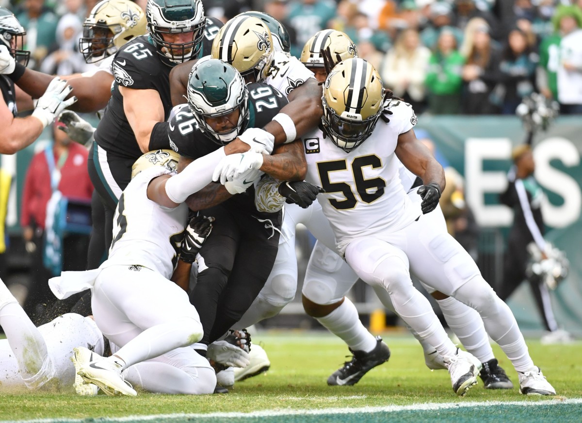 Philadelphia running back Miles Sanders (26) is tackled by New Orleans Saints safety Marcus Williams (43), defensive tackle Josiah Bronson (91) and linebacker Demario Davis (56). Mandatory Credit: Eric Hartline-USA TODAY 