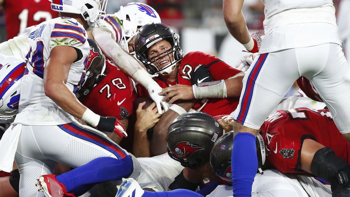 Tom Brady smiles while sneaking the ball into the end zone for a touchdown against the Bills