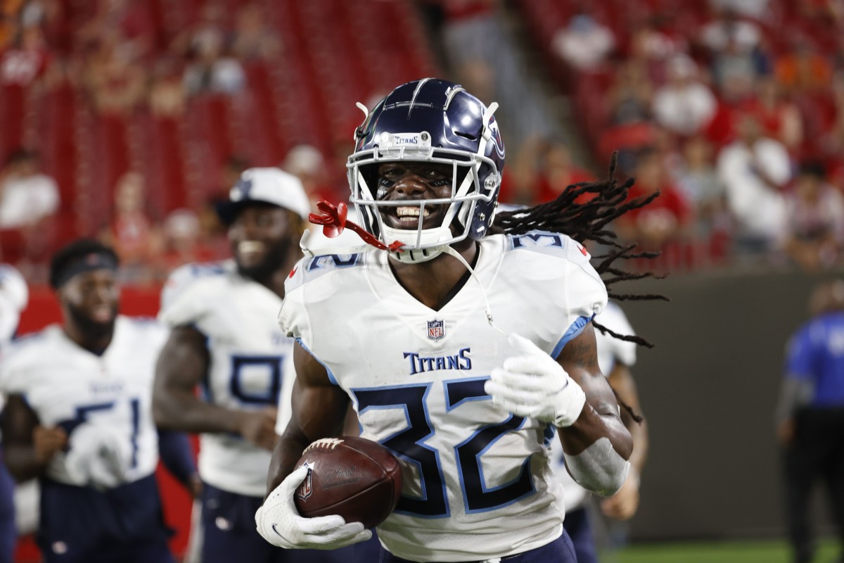 Tennessee Titans cornerback Jamal Carter (32) celebrates after intercepting a pass against the Tampa Bay Buccaneers during the second half at Raymond James Stadium.