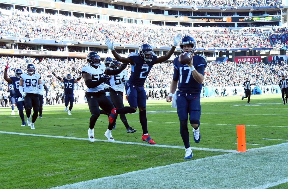 Tennessee Titans quarterback Ryan Tannehill (17) scores on a touchdown run during the second half against the Jacksonville Jaguars at Nissan Stadium.