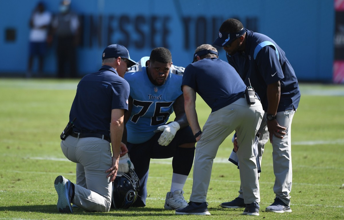 Tennessee Titans guard Rodger Saffold (76) talks with medical staff after an injury against the Kansas City Chiefs at Nissan Stadium.