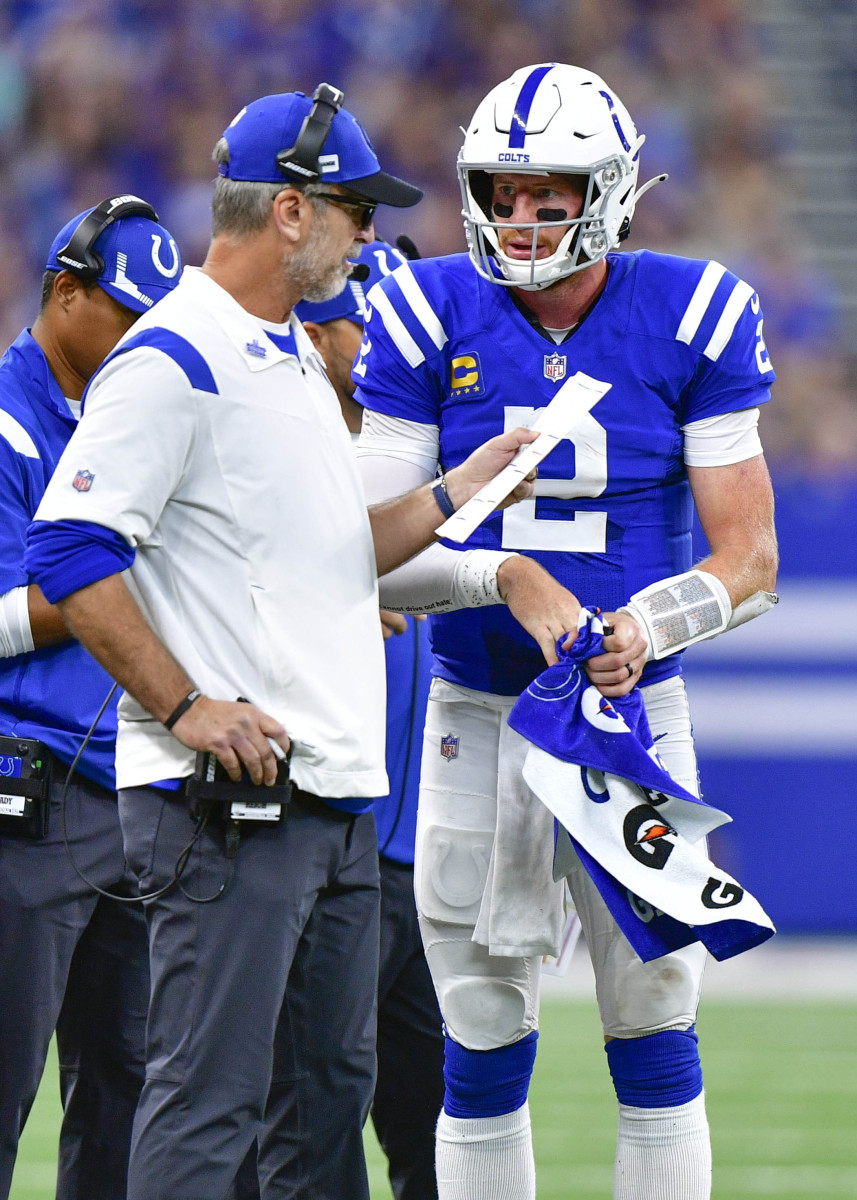 Sep 19, 2021; Indianapolis, Indiana, USA; Indianapolis Colts quarterback Carson Wentz (2) talks to Indianapolis Colts head coach Frank Reich during the second half at Lucas Oil Stadium. Rams win 24-21. Mandatory Credit: Marc Lebryk-USA TODAY Sports
