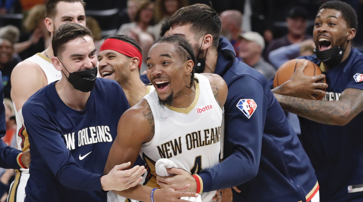 New Orleans Pelicans guard Devonte' Graham (4) celebrates with his team after hitting the game winning three point shot as time expired against the Oklahoma City Thunder