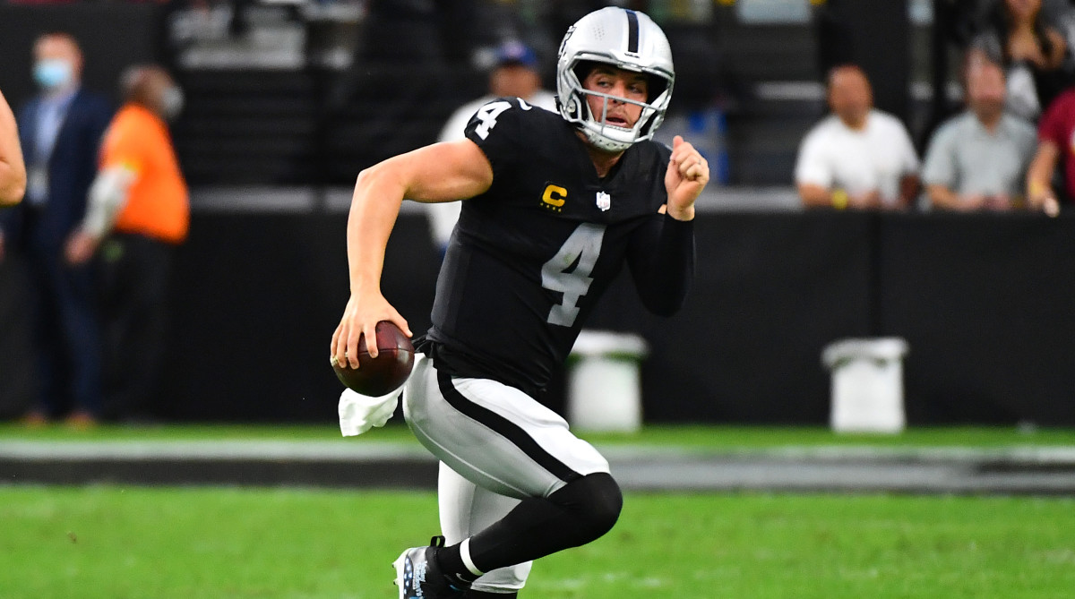 Las Vegas Raiders quarterback Derek Carr (4) is flushed out of the pocket during the second quarter against the Washington Football Team at Allegiant Stadium