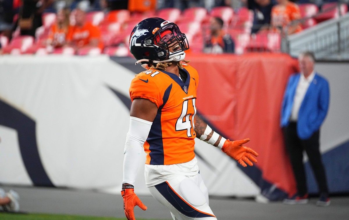 Denver Broncos safety Jamar Johnson (41) celebrates after defeating the Los Angeles Rams following a preseason game at Empower Field at Mile High.