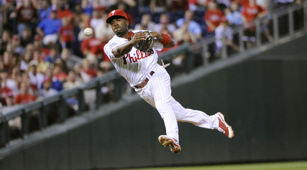 Jun 12, 2009; Philadelphia, PA, USA; Philadelphia Phillies shortstop Jimmy Rollins (11) throws to first base in the ninth inning against the Boston Red Sox at Citizens Bank Park. The Boston Red Sox defeated the Philadelphia Phillies 5-2 in 13 innings.