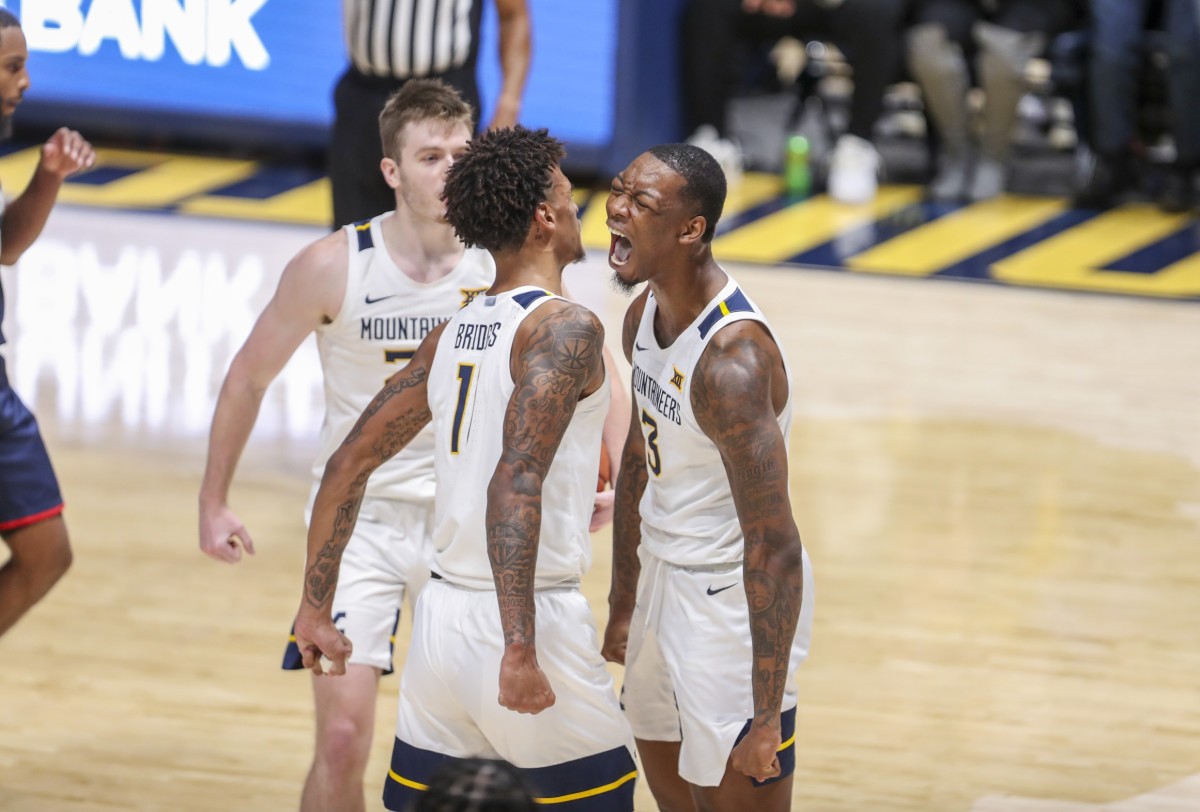 Dec 12, 2021; Morgantown, West Virginia, USA; West Virginia Mountaineers players celebrate after defeating the Kent State Golden Flashes at WVU Coliseum.