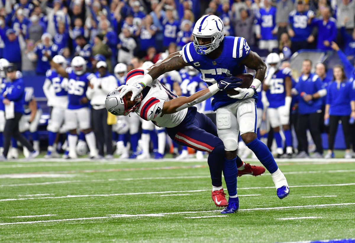Dec 18, 2021; Indianapolis, Indiana, USA; Indianapolis Colts outside linebacker Darius Leonard (53) blocks New England Patriots wide receiver Jakobi Meyers (16) after intercepting the ball during the second quarter at Lucas Oil Stadium. Mandatory Credit: Marc Lebryk-USA TODAY Sports