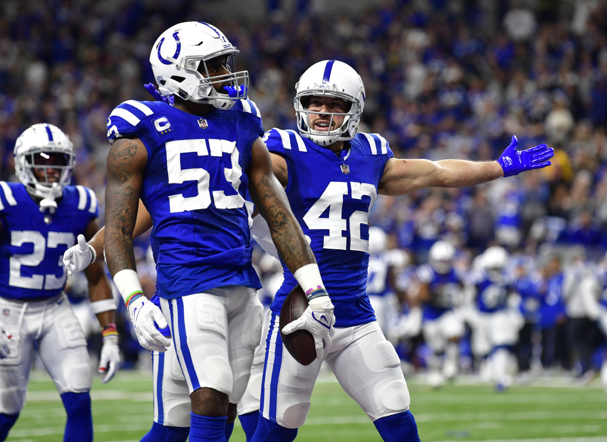 Dec 18, 2021; Indianapolis, Indiana, USA; Indianapolis Colts safety Andrew Sendejo (42) celebrates an interception by Indianapolis Colts outside linebacker Darius Leonard (53) during the second quarter against the New England Patriots at Lucas Oil Stadium. Mandatory Credit: Marc Lebryk-USA TODAY Sports