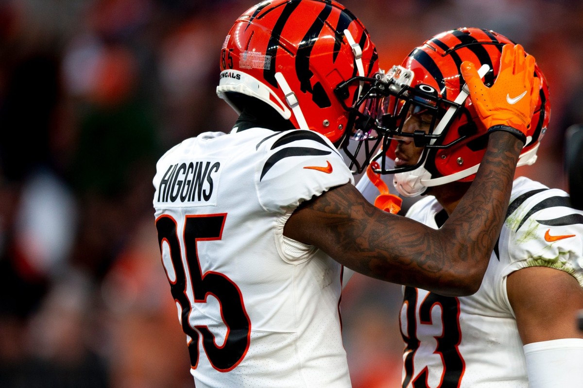 Cincinnati Bengals wide receiver Tyler Boyd (83) celebrates with Cincinnati Bengals wide receiver Tee Higgins (85) after scoring a touchdown in the second half the NFL football game on Sunday, Dec. 19, 2021, at Empower Field in Denver, Co. Cincinnati Bengals defeated Denver Broncos 15-10. Cincinnati Bengals At Denver Broncos 394