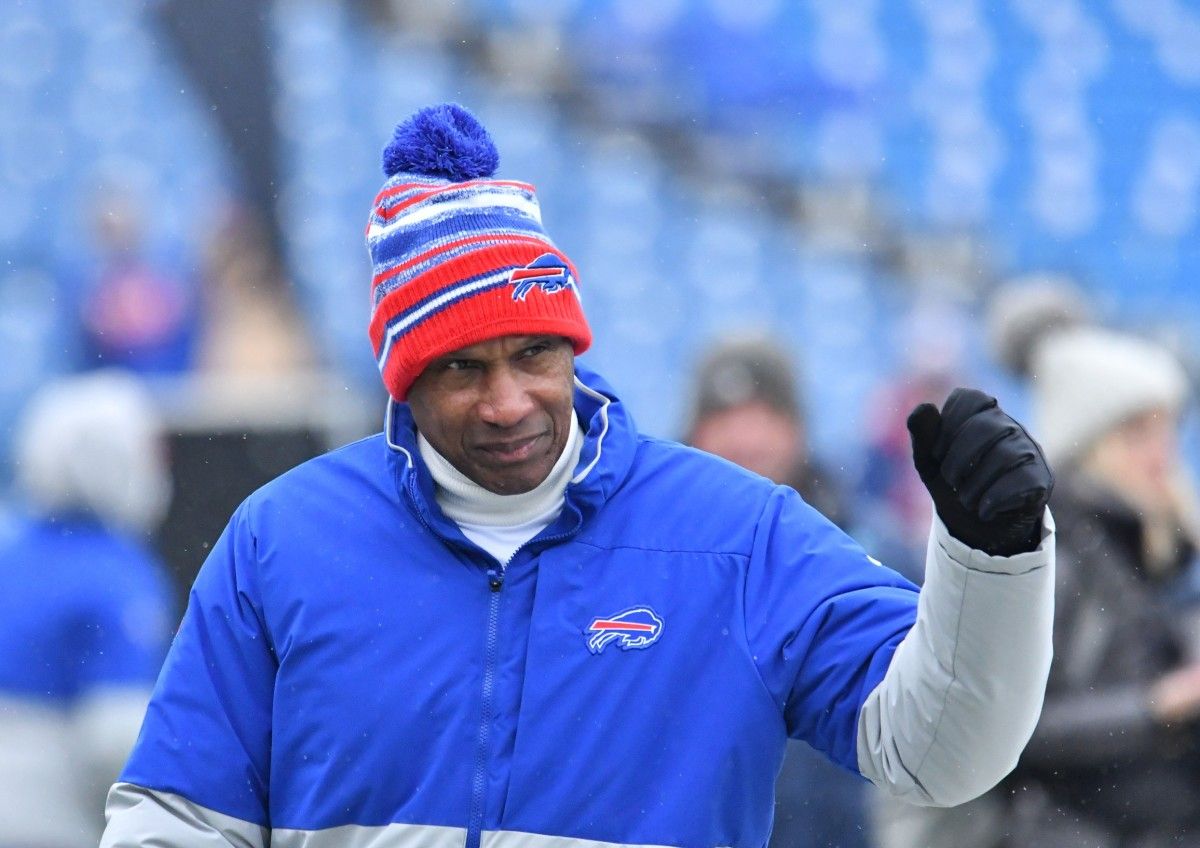 Buffalo Bills defensive coordinator Leslie Frazier walks the field before a game against the Carolina Panthers at Highmark Stadium.