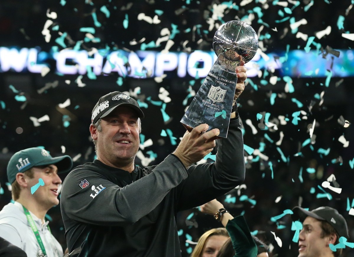 Philadelphia Eagles head coach Doug Pederson hoist the Vince Lombardi Trophy after a victory against the New England Patriots in Super Bowl LII at U.S. Bank Stadium.