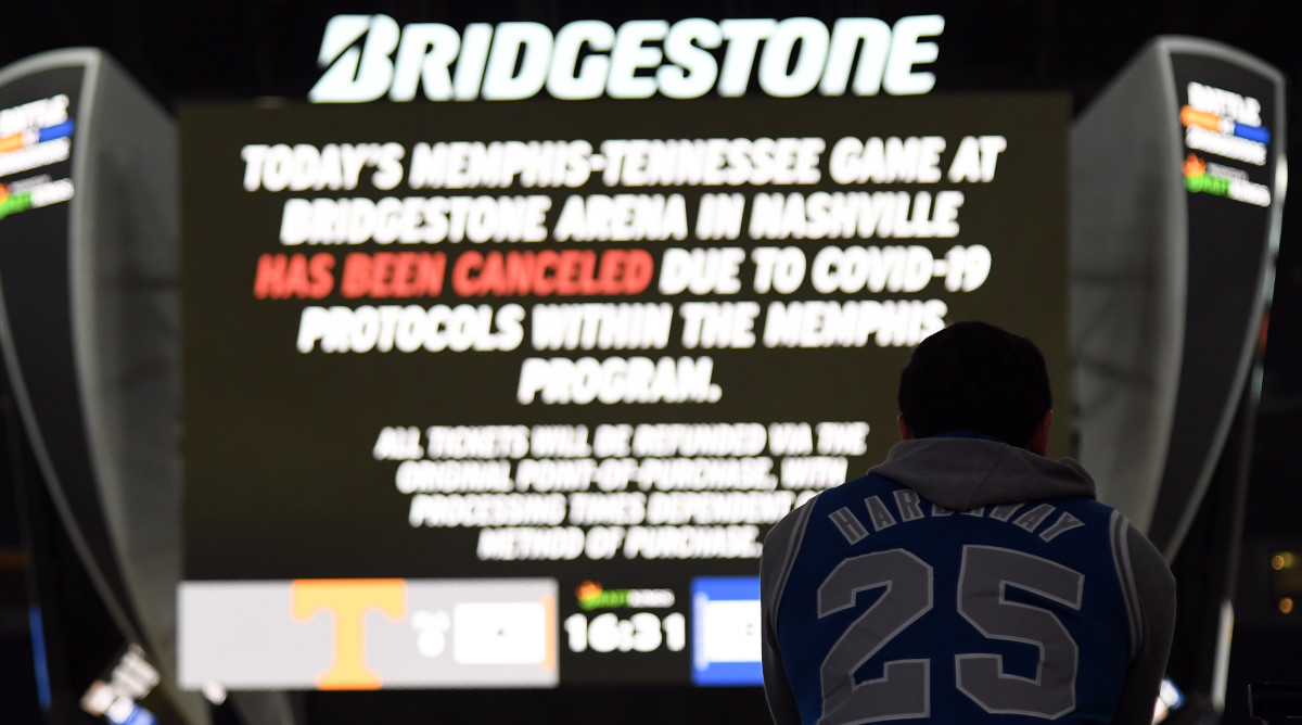 A Memphis Tigers fan looks on as Tennessee Volunteers players scrimmage after the game was canceled due to COVID-19 protocol in the Tigers' program at Bridgestone Arena.