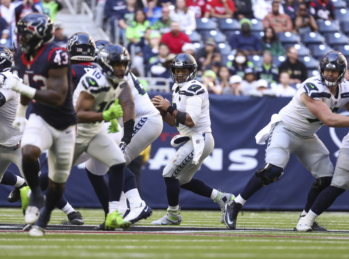 NFL: Seattle Seahawks at Houston Texans Dec 12, 2021; Houston, Texas, USA; Seattle Seahawks quarterback Russell Wilson (3) looks for an open receiver during the fourth quarter against the Houston Texans at NRG Stadium.