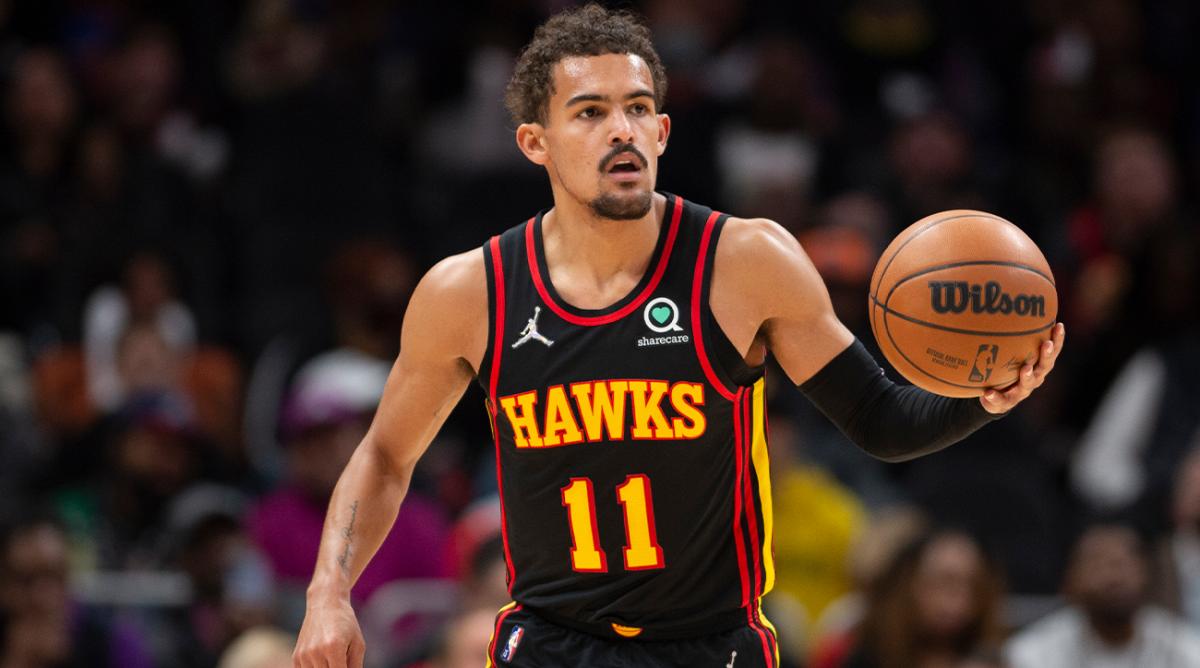 Atlanta Hawks guard Trae Young (11) dribbles up court during the first half of an NBA basketball game against the New York Knicks Saturday, Nov. 27, 2021, in Atlanta.