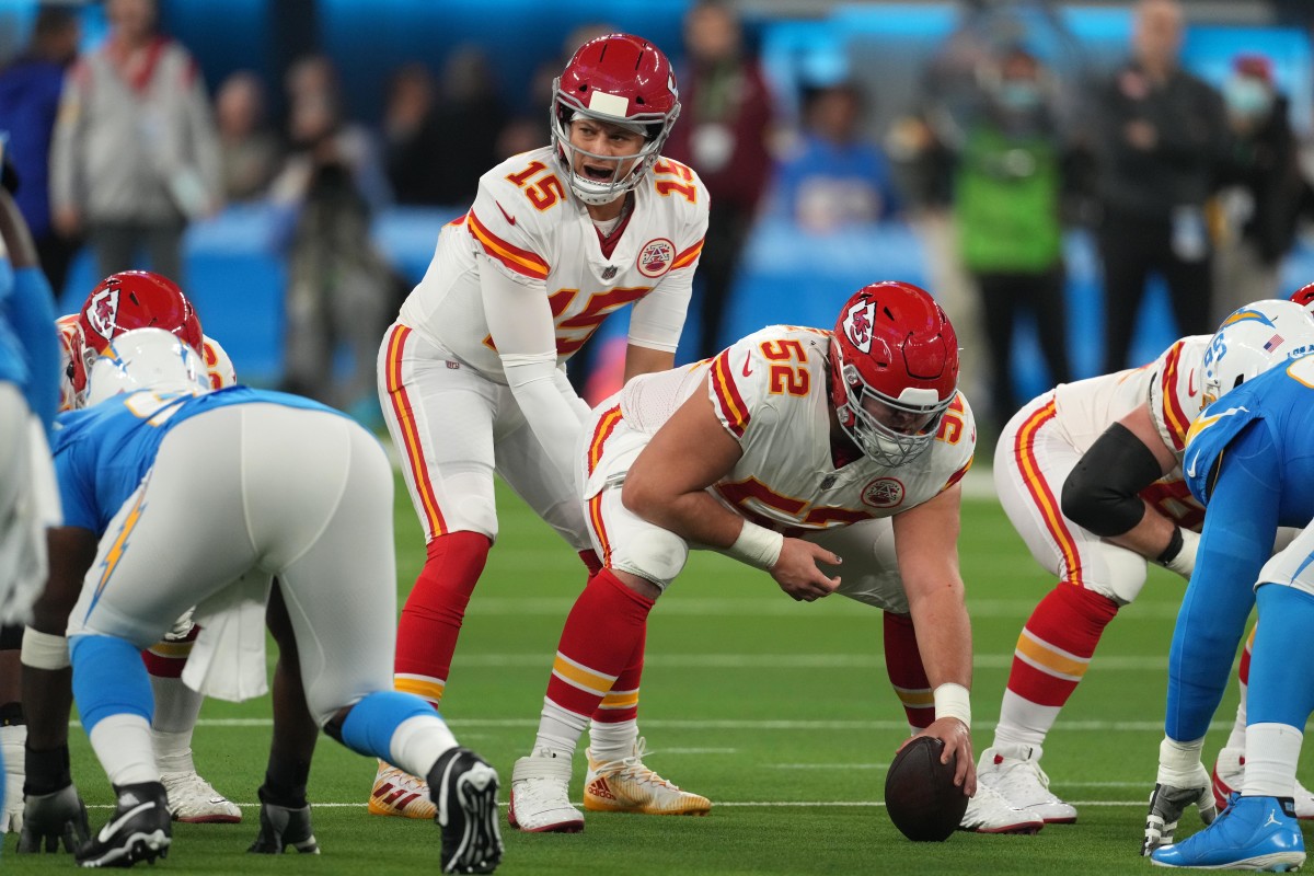 Dec 16, 2021; Inglewood, California, USA; Kansas City Chiefs quarterback Patrick Mahomes (15) prepares to take the snap from center Creed Humphrey (52) in the first half against the Los Angeles Chargers at SoFi Stadium. Mandatory Credit: Kirby Lee-USA TODAY Sports