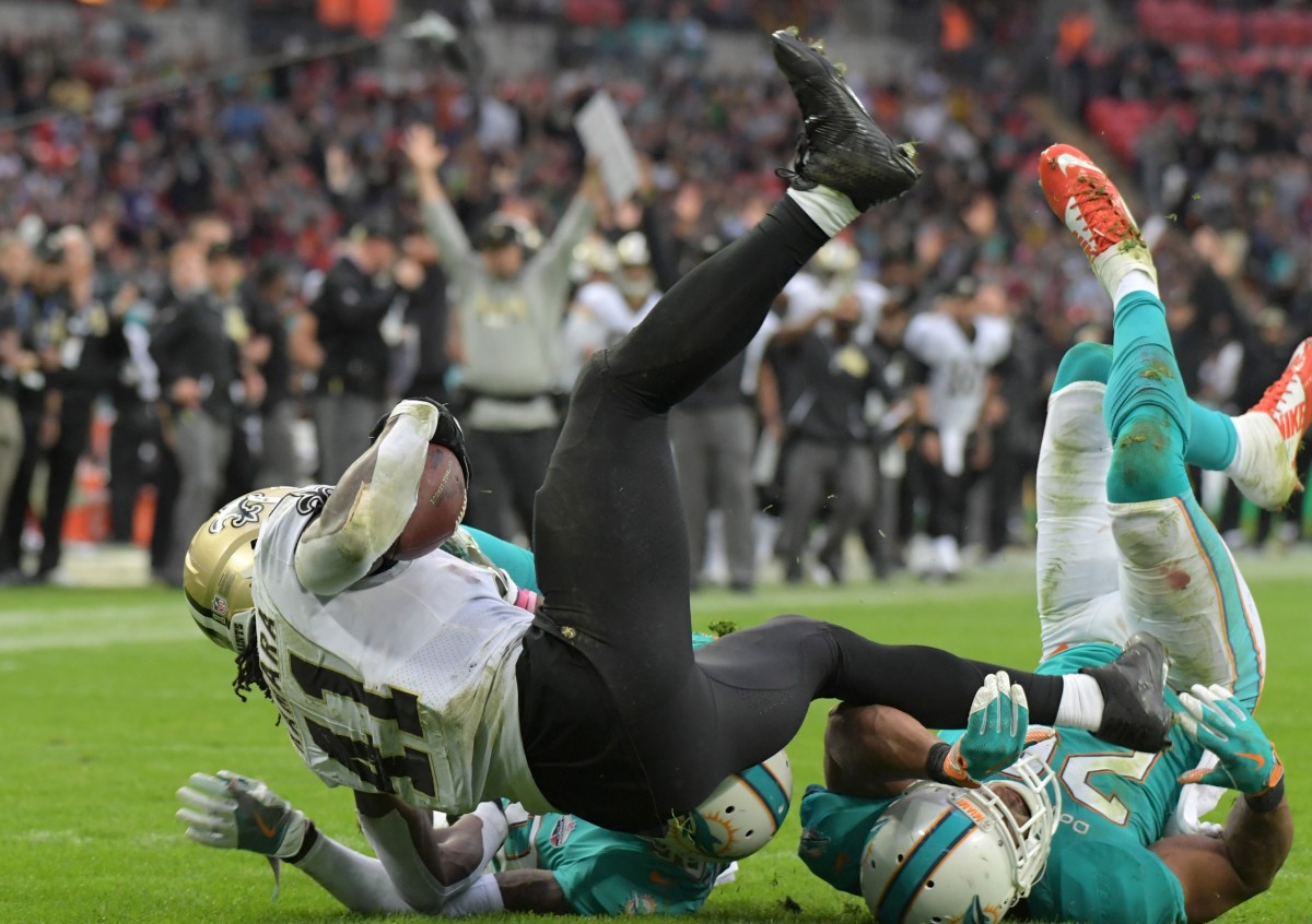 New Orleans Saints running back Alvin Kamara (41) is stopped by the Miami Dolphins. Mandatory Credit: Kirby Lee-USA TODAY Sports