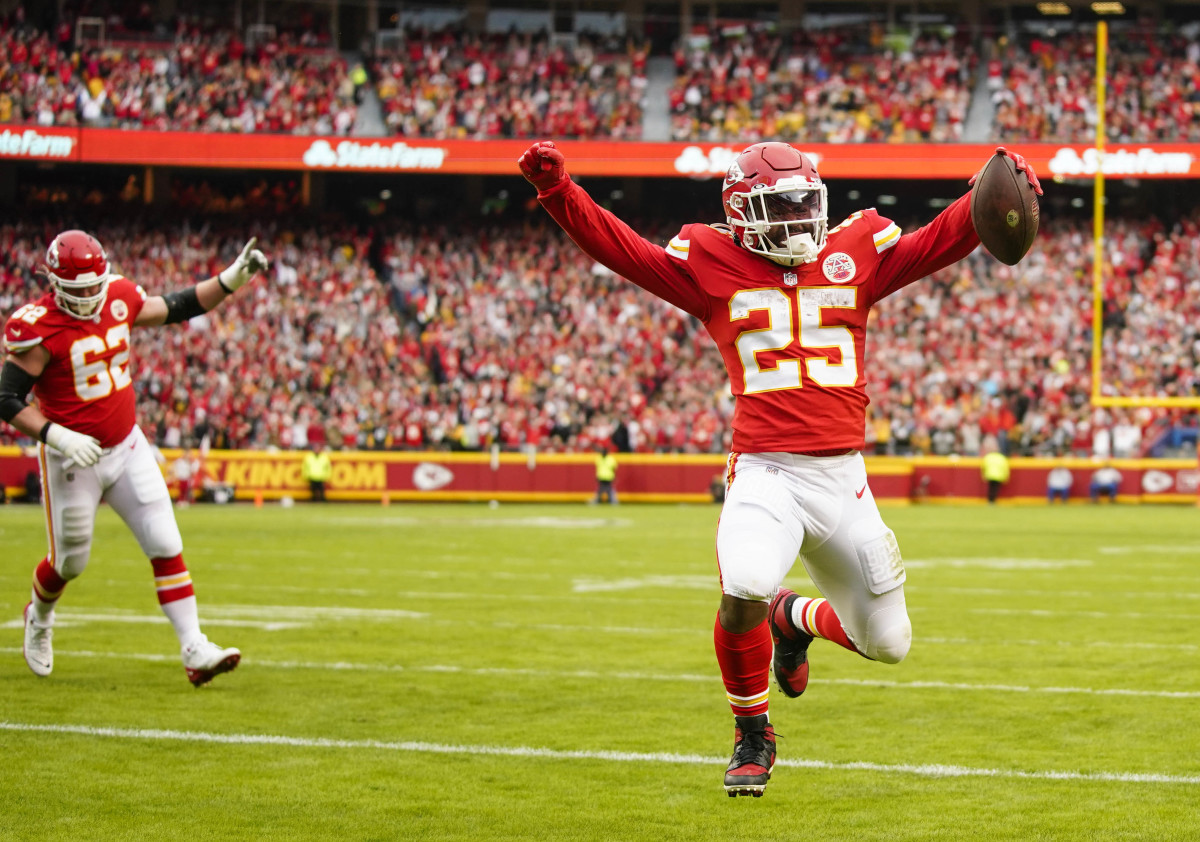Dec 26, 2021; Kansas City, Missouri, USA; Kansas City Chiefs running back Clyde Edwards-Helaire (25) celebrates as he runs for a touchdown against the Pittsburgh Steelers during the first half at GEHA Field at Arrowhead Stadium. Mandatory Credit: Jay Biggerstaff-USA TODAY Sports