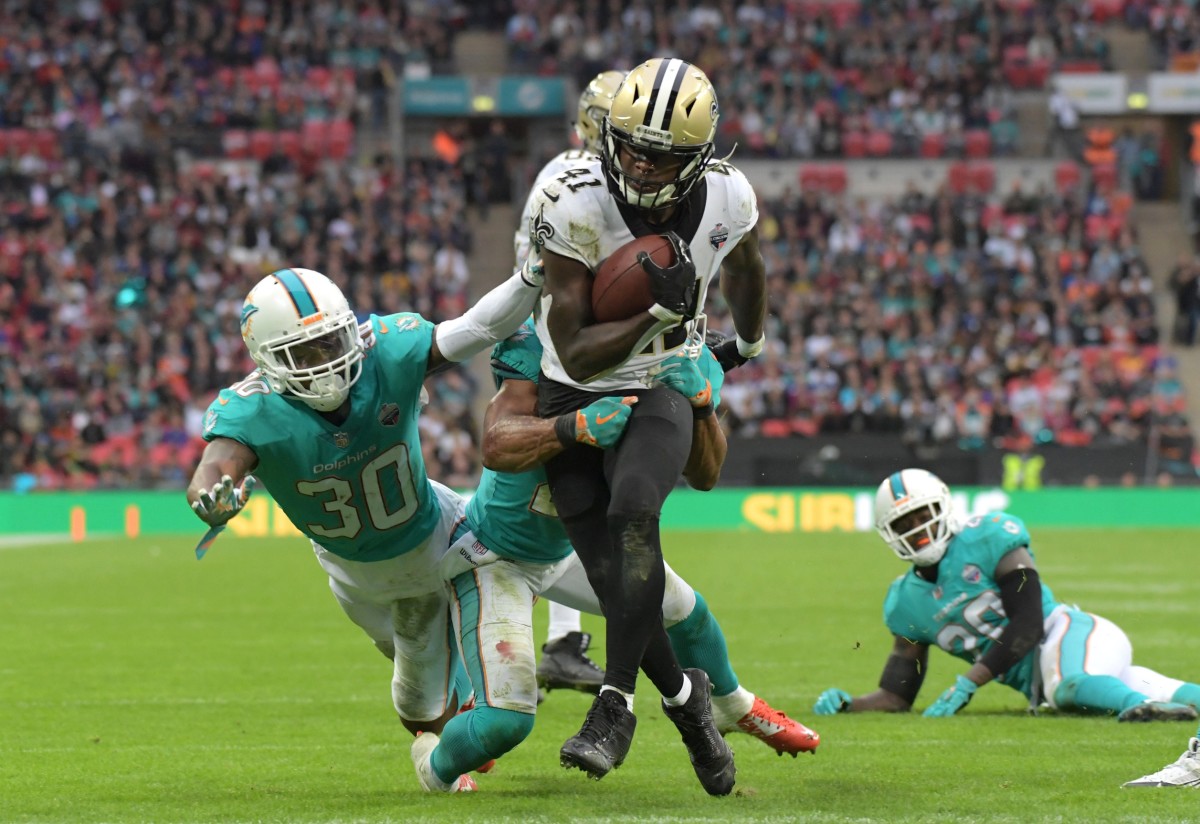 New Orleans Saints running back Alvin Kamara (41) scores on a 12-yard touchdown reception against Miami. Mandatory Credit: Kirby Lee-USA TODAY 