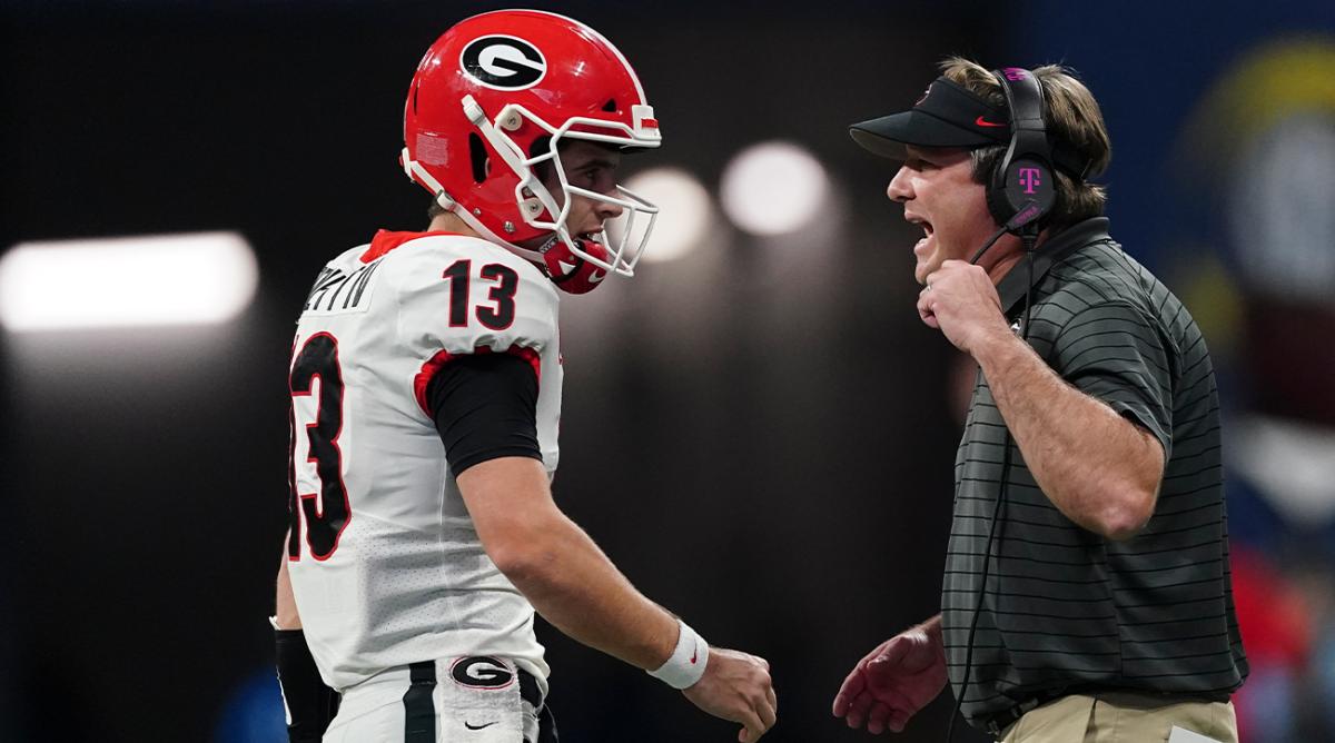 Georgia head coach Kirby Smart speaks on the field during the first half of the Southeastern Conference championship NCAA college football game against Alabama, Saturday, Dec. 4, 2021, in Atlanta.