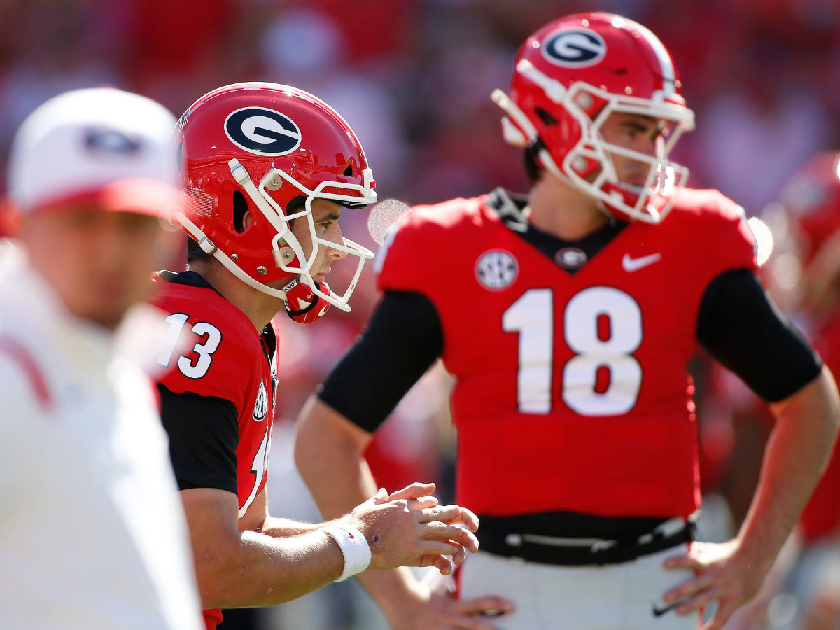 Georgia QB Stetson Bennett warms up with JT Daniels in the background