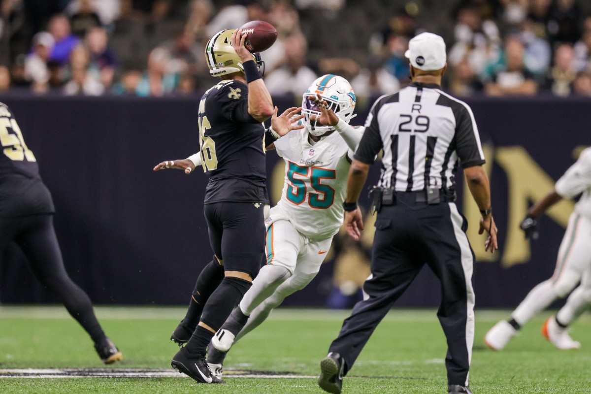 New Orleans quarterback Ian Book (16) passes over Dolphins linebacker Jerome Baker (55). Mandatory Credit: Stephen Lew-USA TODAY Sports