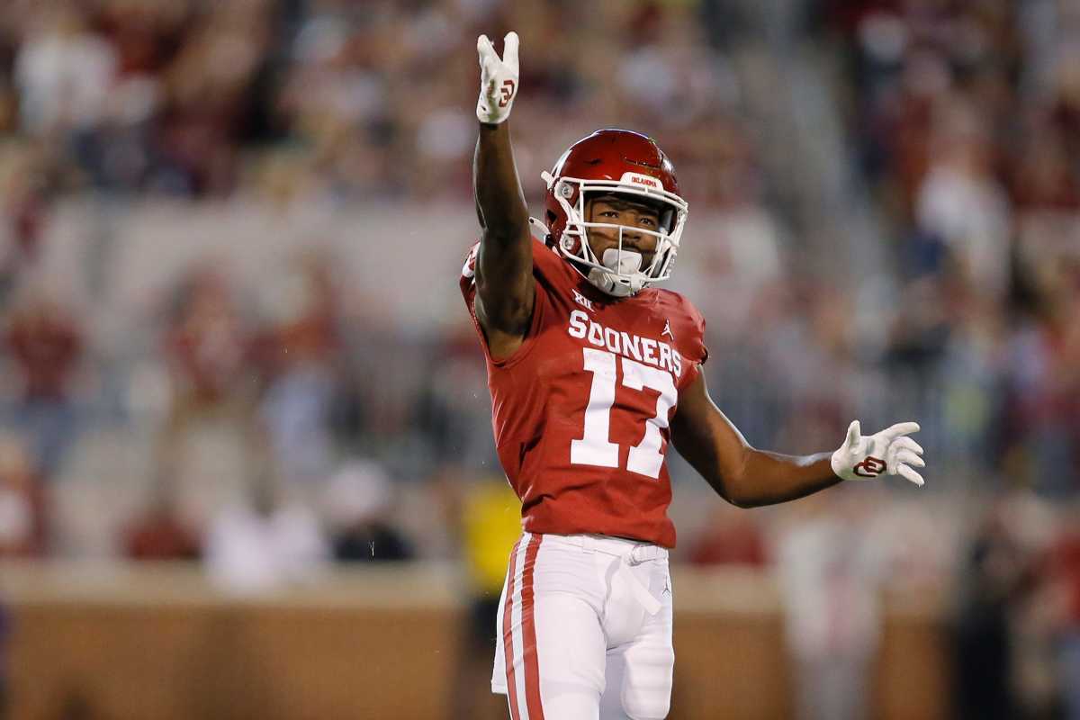 Oklahoma's Marvin Mims (17) gestures after getting a first down against the TCU Horned Frogs.