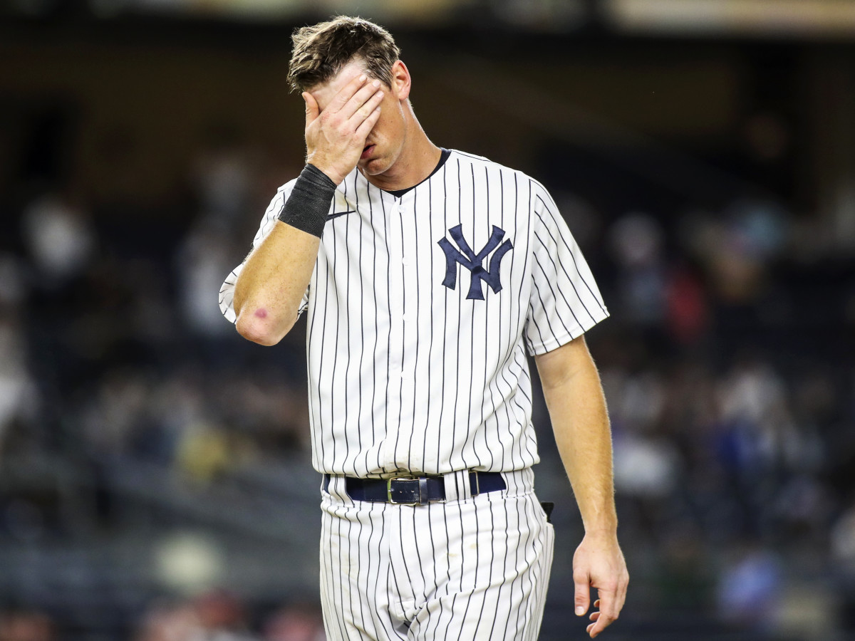 Sep 8, 2021; Bronx, New York, USA;  New York Yankees second baseman DJ LeMahieu (26) wipes his face after the Yankees fail to score in the eighth inning against the Toronto Blue Jays at Yankee Stadium.