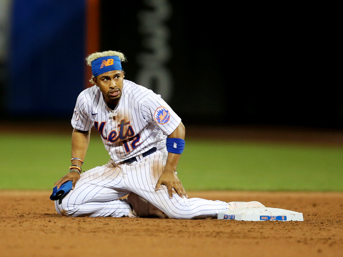 Jun 21, 2021; New York City, New York, USA; New York Mets shortstop Francisco Lindor (12) reacts after being picked off first and caught trying to steal second base against the Atlanta Braves during the sixth inning at Citi Field.