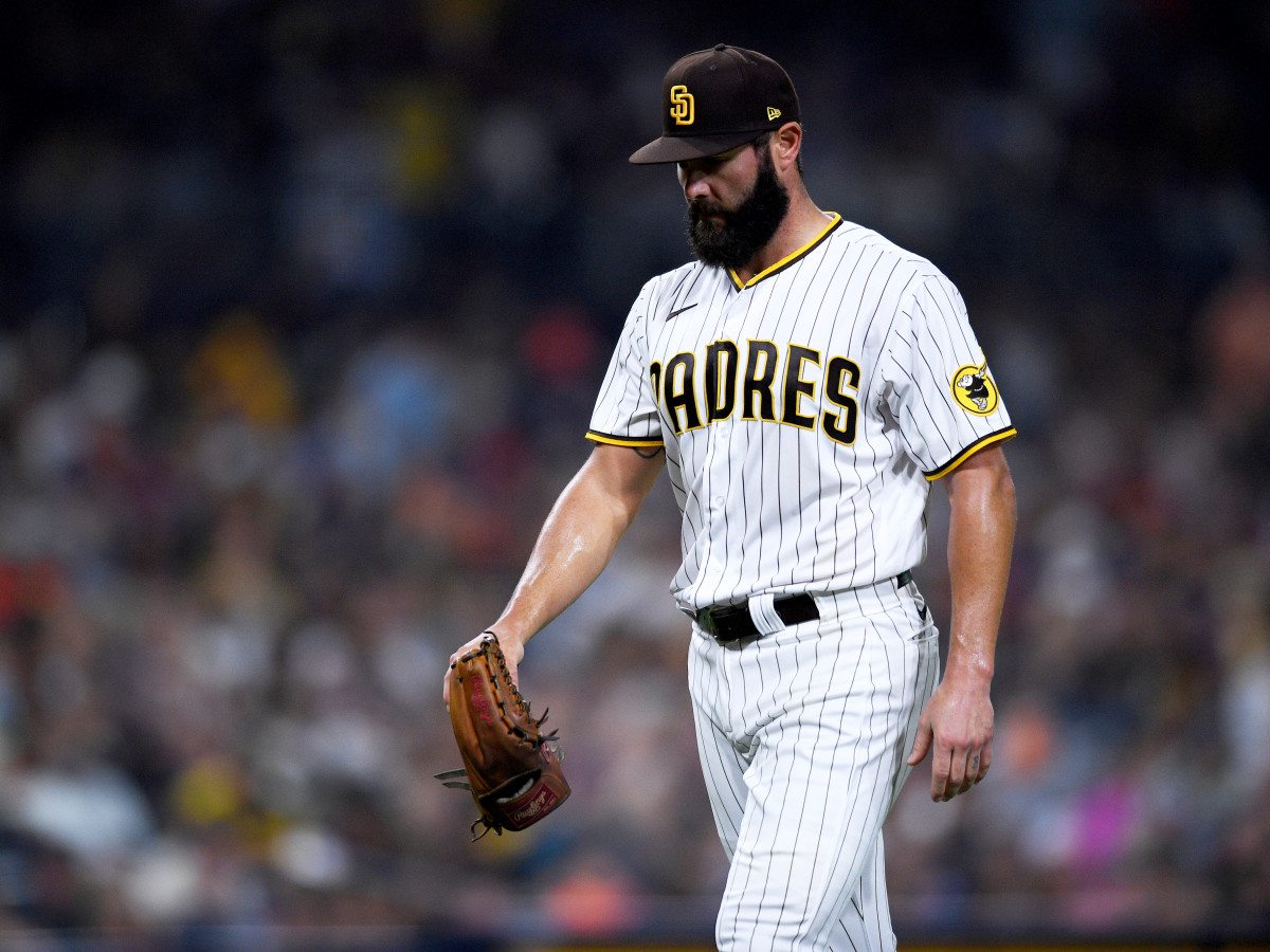 Sep 3, 2021; San Diego, California, USA; San Diego Padres starting pitcher Jake Arrieta (49) walks to the dugout after the last out of the top the fifth inning against the Houston Astros at Petco Park.