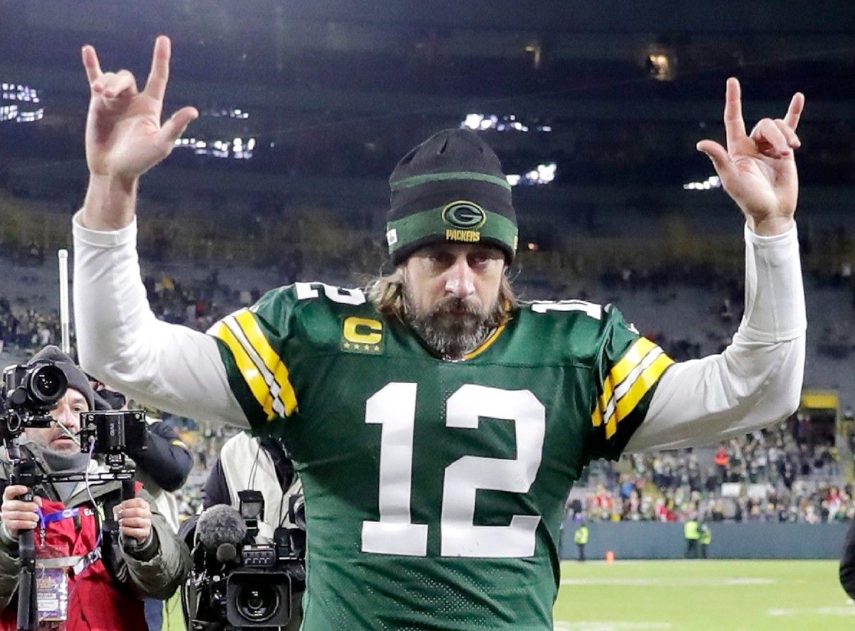 Green Bay Packers quarterback Aaron Rodgers (12) leaves the field after leading the Packers over the Cleveland Browns on Saturday, December 25, 2021, at Lambeau Field in Green Bay, Wis.