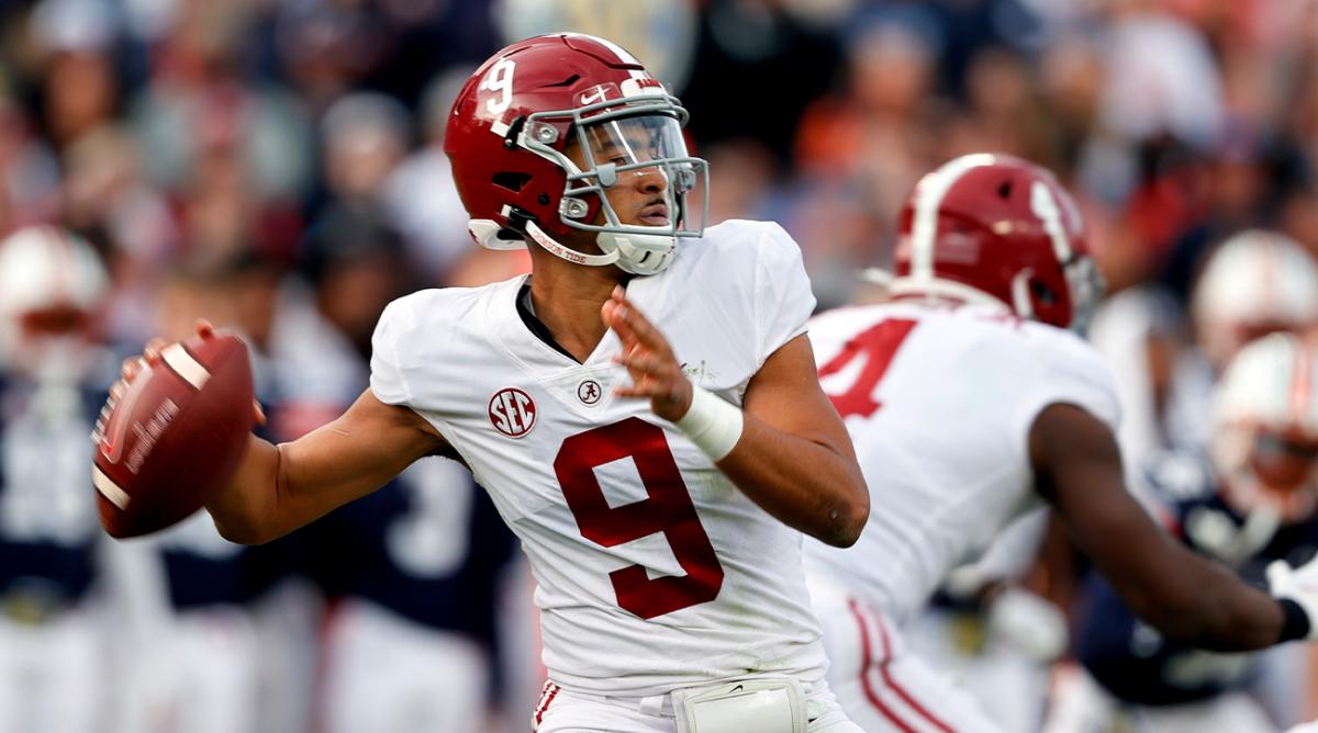 FILE - Alabama quarterback Bryce Young (9) throws a pass against Auburn during the first half of an NCAA college football game, Nov. 27, 2021, in Auburn, Ala. Young has been selected as an All-American by The Associated Press, giving the top-ranked Crimson Tide more players on the first team than any other school.