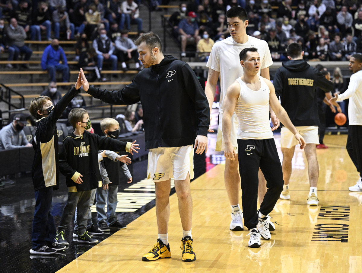 Sasha Stefanovic high fives a young fan before the Purdue, Nicholls State game at home.